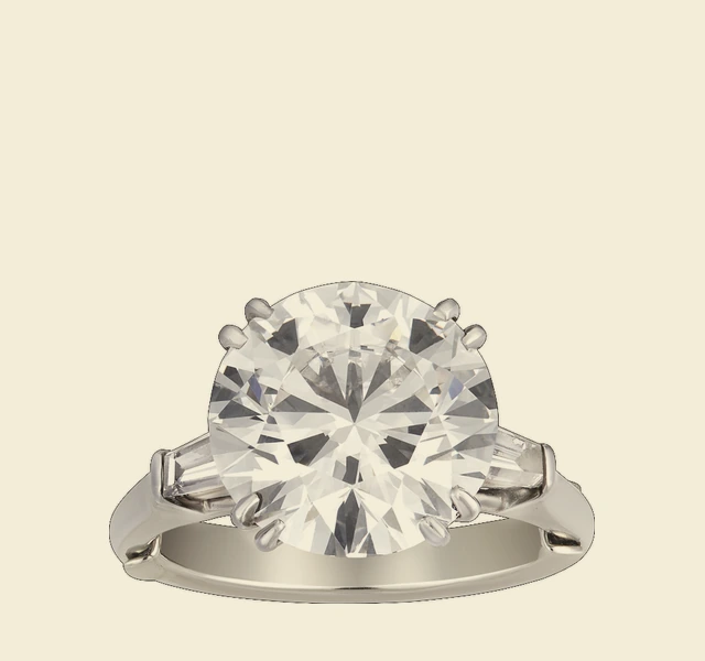 Ring, brilliant-cut diamond flanked by baguette diamonds